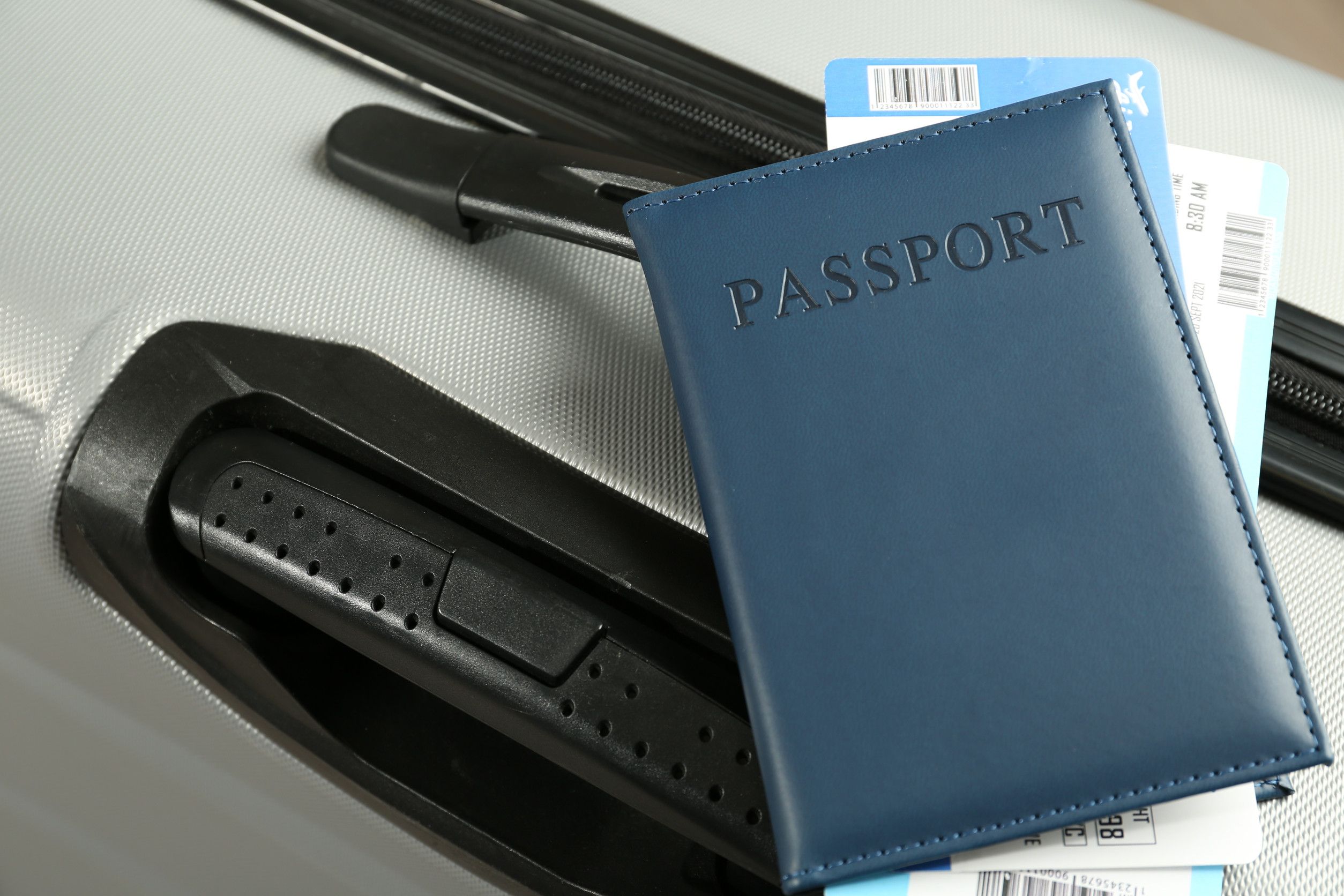 Passport and flight tickets on suitcase Passport and flight tickets on suitcase