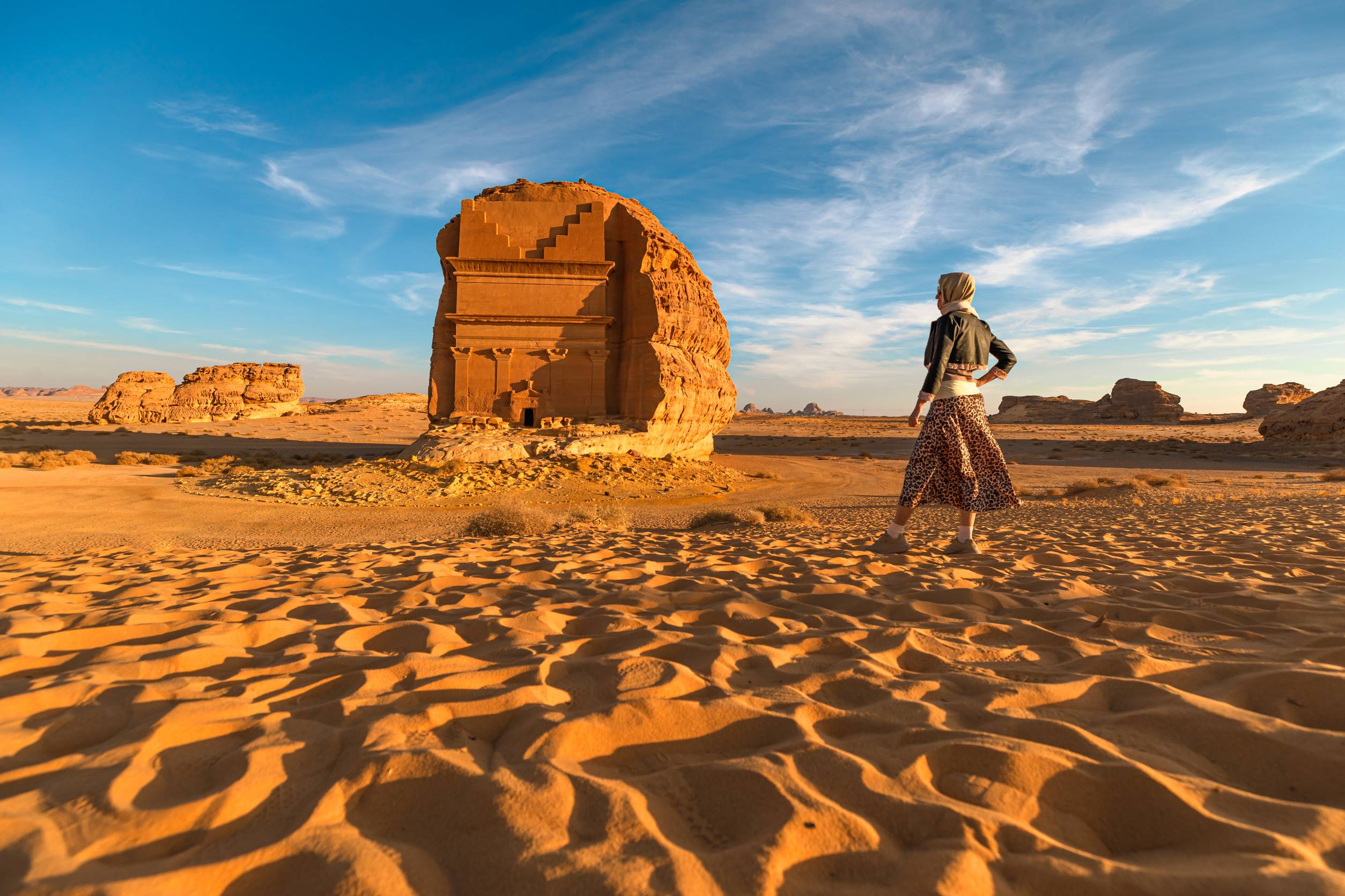 Blonde Tourist Walking In The Desert Admiring The Monumental Qasr Al Farid A Solitary Nabataean Blonde Tourist Walking In The Desert Admiring The Monumental Qasr Al Farid A Solitary Nabataean