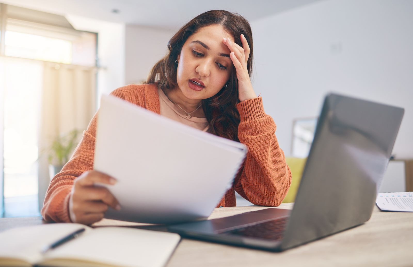 Stressed women holding documents Stressed women holding documents
