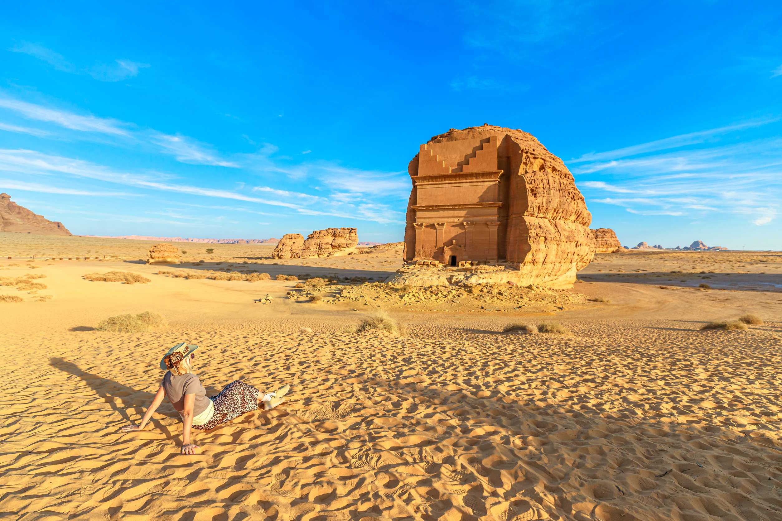 Woman Tourist Is Enjoying The View Of The Majestic Qasr Al Farid The Tomb Of Lihyan Son Of Kuza Woman Tourist Is Enjoying The View Of The Majestic Qasr Al Farid The Tomb Of Lihyan Son Of Kuza